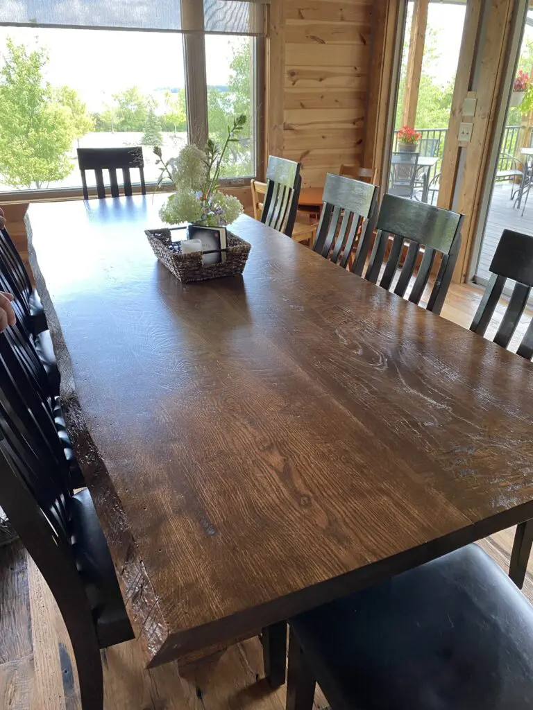 A large wooden table with chairs around it